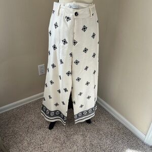 White palazzo pants with black embroidered pattern, size small
